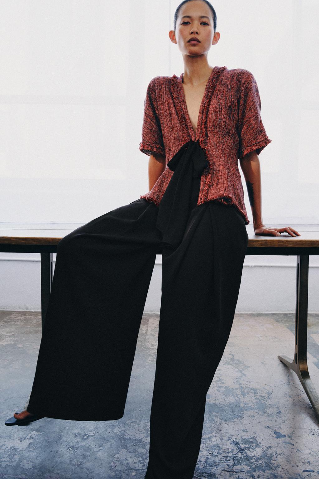 top s peplum detaljem